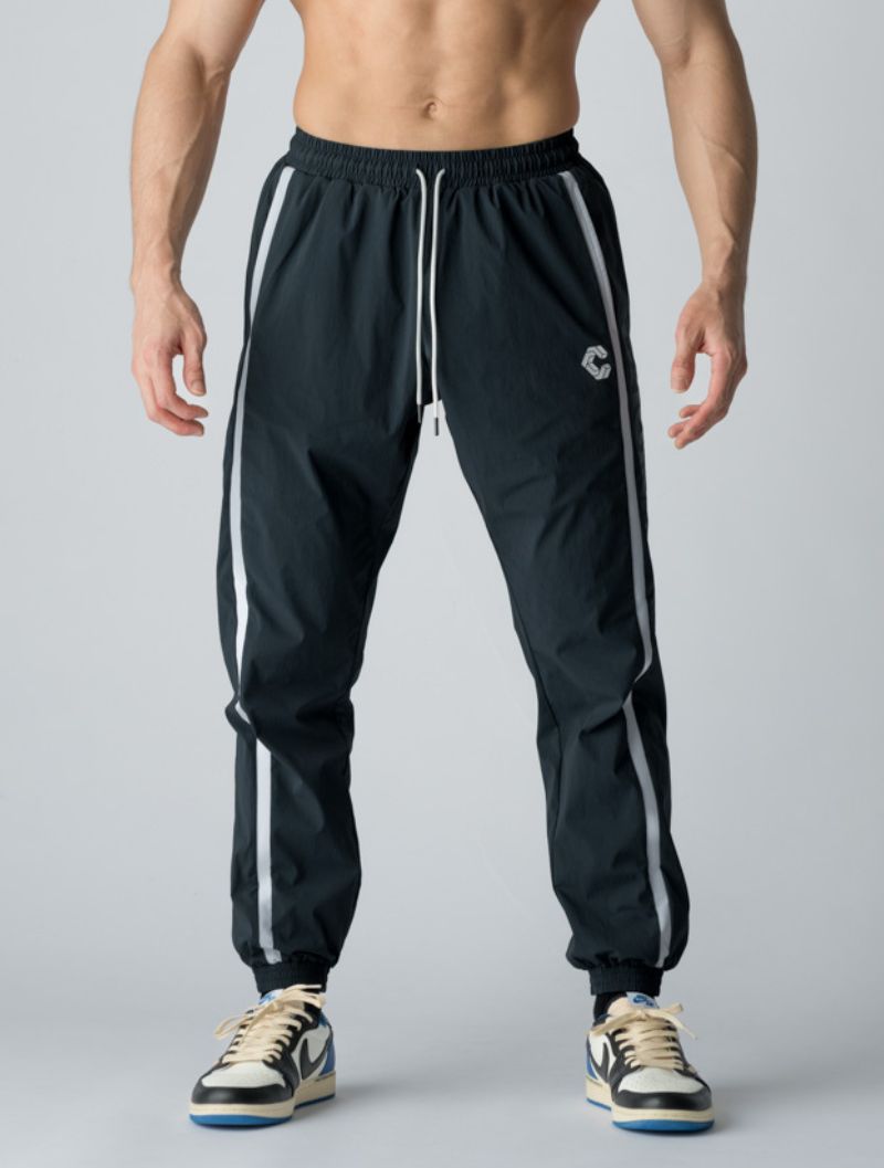 CRONOS 側邊標誌風衣長褲 (藍) - AROAK 機能健身服飾 | 專為健人打造